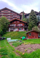 Wooden houses in the Murren mountains in Switzerland on a cloudy day