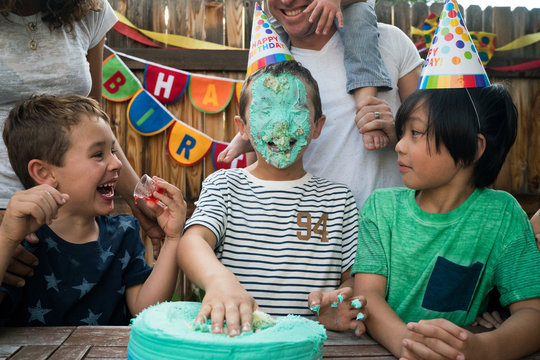 Family celebrating birthday outdoors