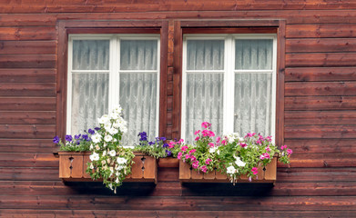Facade with flowers on the windows in switzerland
