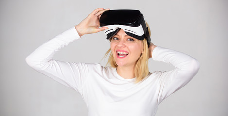 Woman using virtual reality headset. Young woman using a virtual reality headset. Funny young woman with VR. Smartphone using with VR headset.