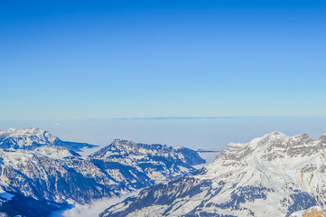 Fototapeta na wymiar White and blue Alps in Switzerland during winter