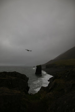 Scenic view of beach against cloudy sky