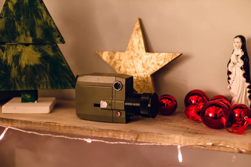 Set of photography gears with vintage camcorder, holy maiden, christmas red balls, star cone on...