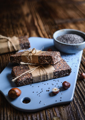 Chocolate chia seeds bars with hazelnuts, rolled oats, dates, coconut and honey