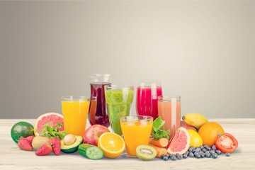 Fresh fruits and juice isolated on white backgroundFresh fruits