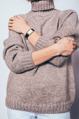 Fashionable young woman wearing warm winter sweater