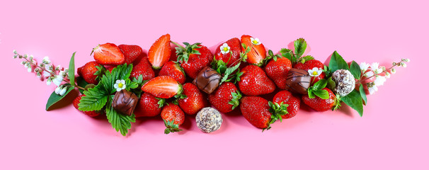 Fresh, red strawberries on pink background, top view. copy space