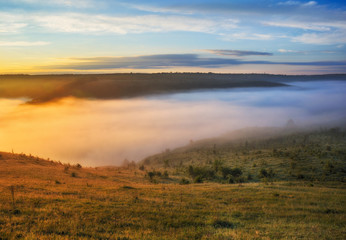 Fototapeta premium foggy canyon of a picturesque river. spring dawn