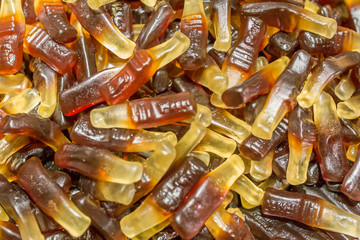 Jelly-candy texture, cola flavor, shape of cola bottles.