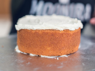 A beautiful organic delicious orange warm baked sponge cake, with fresh cream inside.