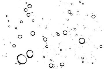 Fizzy mineral water closeup detailed bubbles shapes isolated on white. Transparent round drops pattern.