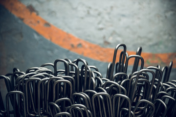 Rustic rusty metal steel industrial hooks used for hanging industrial manufactured parts. Strong rough hard cold industrial tools.