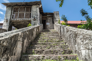 Fototapeta na wymiar old stone staircase in Baclayon catolic Church in Bohol Island, Philippines.