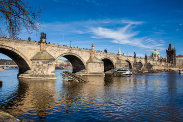 Fototapeta na wymiar PRAGUE, CZECH REPUBLIC - APRIL, 2018: The medieval Charles Bridge over the Vltava river in Prague city