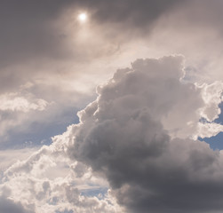 Storm Clouds and Sun Background