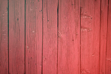 The rough wooden surface in the coral color
