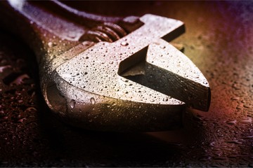 Tool belt with tools on wooden background