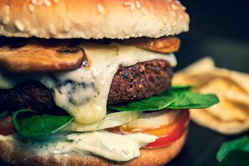 Hamburger vegetarian burger with falafel and vegetables salad tomato champignon and cheese tofu...