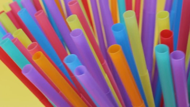 straw straws plastic background disposable drinking straw with copy space environmental waste single use footage 