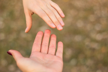 Sisters hold hands 