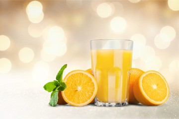 Orange juice and slices of orange on background © BillionPhotos.com