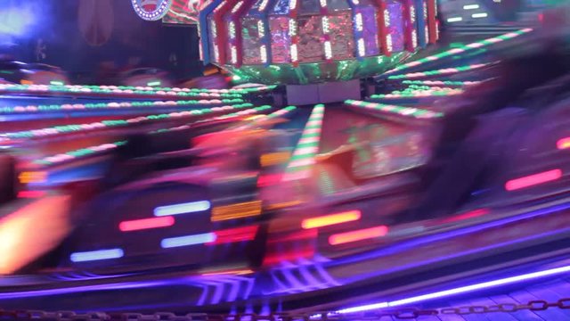 fairground funfair ride bokeh lights defocussed blur background stock footage film clip 