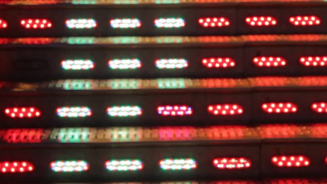 waltzer funfair ride at fairground flashing disco lights - stock footage 