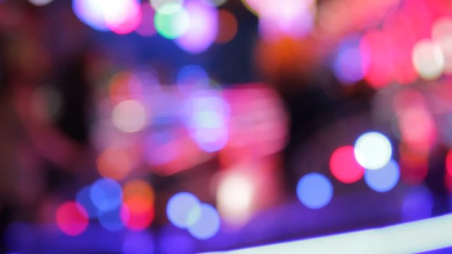 disco lights funfair fairground ride rainbow bokeh lights rides moving flashing people at night