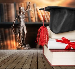 Graduation cap with books  and Degree