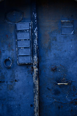 old wooden blue door with lock