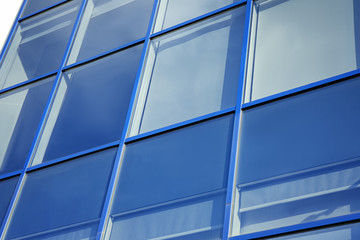 Modern office building with tinted windows. Urban architecture