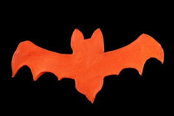 Figure of an orange bat made of clay by a child