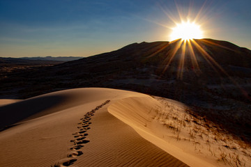 Fototapeta na wymiar sand dune sunset footprints
