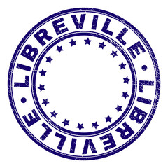LIBREVILLE stamp seal watermark with distress texture. Designed with circles and stars. Blue vector rubber print of LIBREVILLE tag with corroded texture.