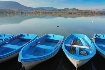 The lake of Banyoles with small boats in foreground, Province of Girona, Catalonia, Spain