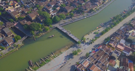 Aerial view panorama of Hoi An old town or Hoian ancient town. Royalty high-quality free stock video footage top view rooftop of street walking in Hoi An city. HoiAn city is UNESCO world heritage site