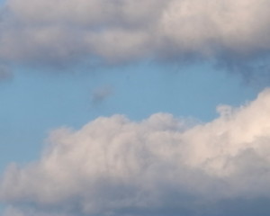 plane detail of heavenly sky with white and gray clouds
