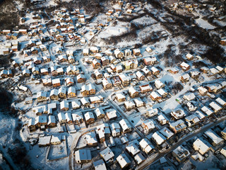 Aerial of rooftops covered with snow