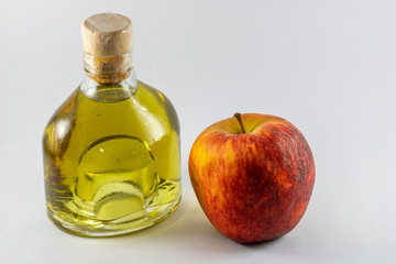 bottle liquor and apple isolated on white background