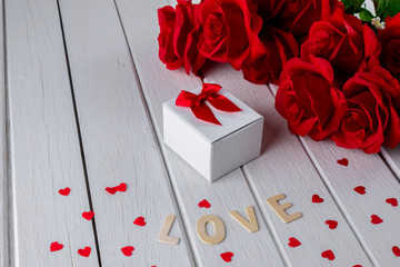 Valentines background with red rose, Heart shape, Gift box, Wooden letters word "LOVE"