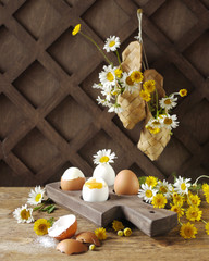 Boiled eggs on wooden stand. Rustic breakfast