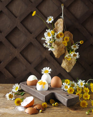 Boiled eggs on wooden stand. Rustic breakfast