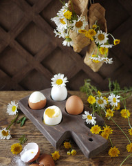Obraz na płótnie Canvas Boiled eggs on wooden stand. Rustic breakfast