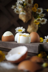 Boiled eggs on wooden stand. Rustic breakfast