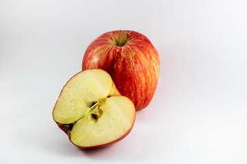 two red apples on white background