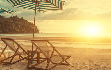 Beach chair on sunset vintage tone