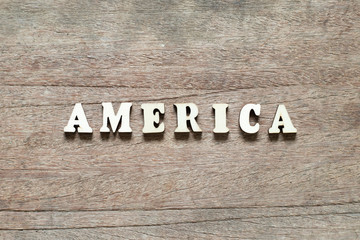 Letter block in word america on wood background
