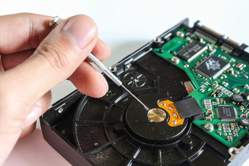 Use Screwdriver to remove screw to check Hard Disk Drive