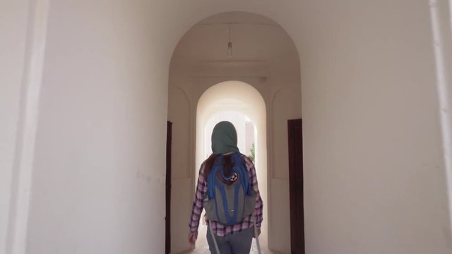 Female tourist walking along Tabatabaei Historical House, Kashan