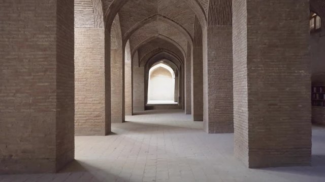 Vaulted arch passageway among columns at Jameh Mosque of Isfahan